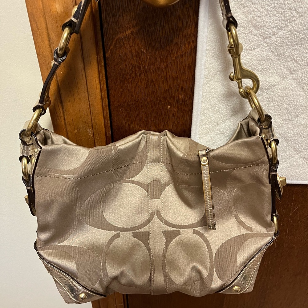 Pretty Coach medium sized gold bag/purse with signature logo.